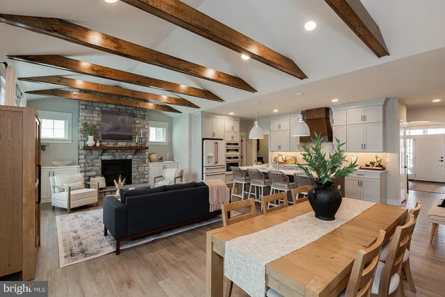 a view of a dining room with furniture and a fireplace