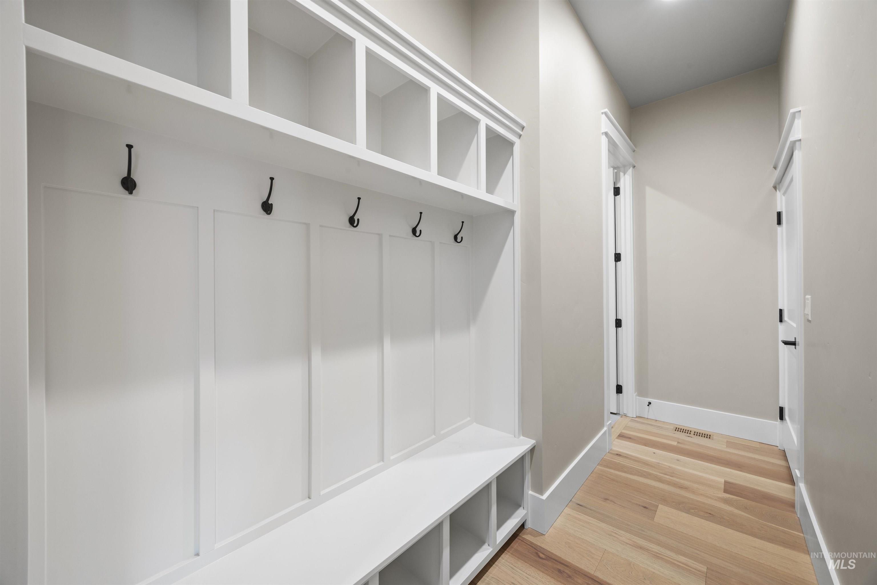 934 East Escalation Street Meridian, ID 83642 - Photo 15 of 50 Mudroom with light wood-style flooring and baseboards