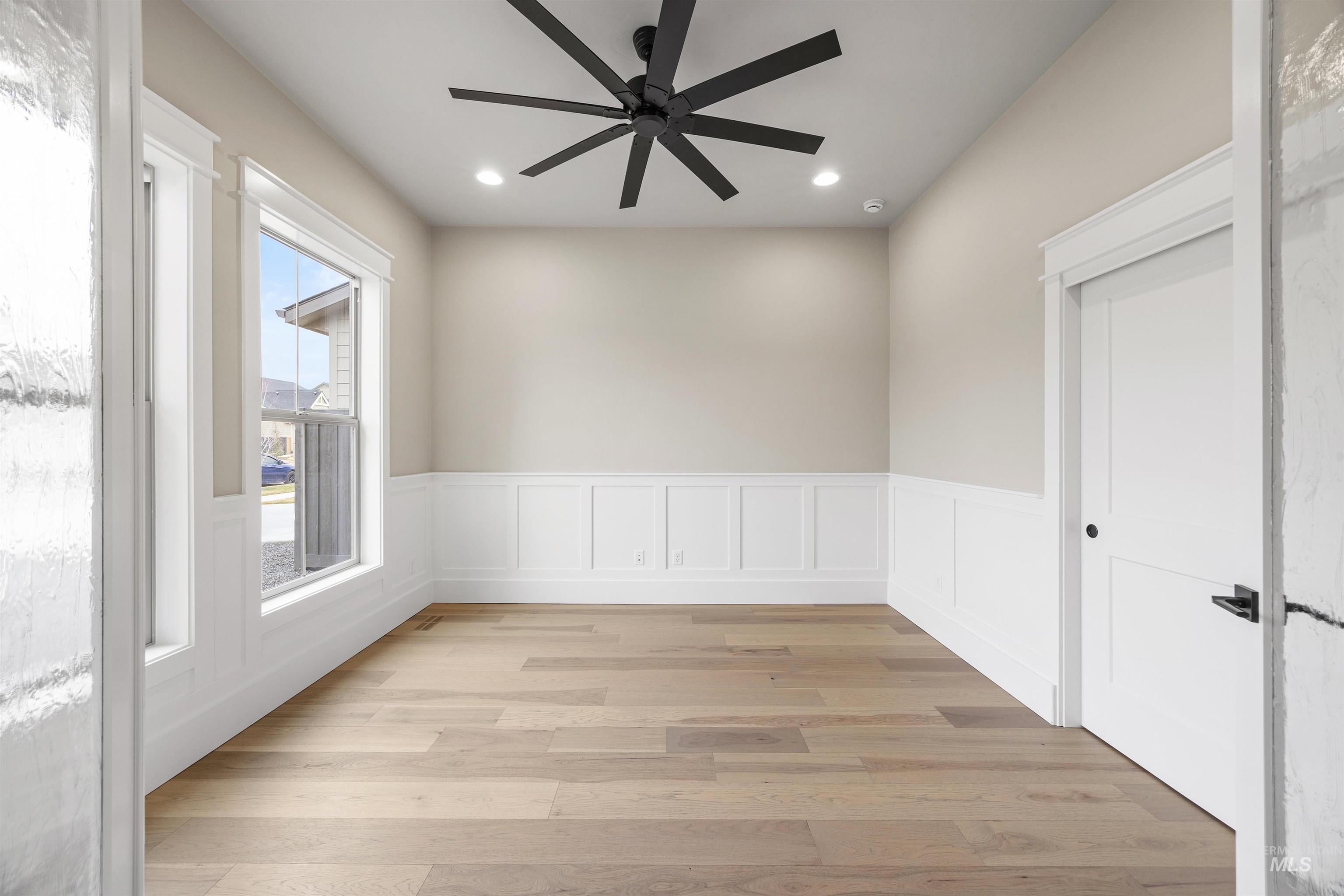 934 East Escalation Street Meridian, ID 83642 - Photo 5 of 50 Unfurnished room featuring wainscoting, ceiling fan, light wood finished floors, a decorative wall, and recessed lighting