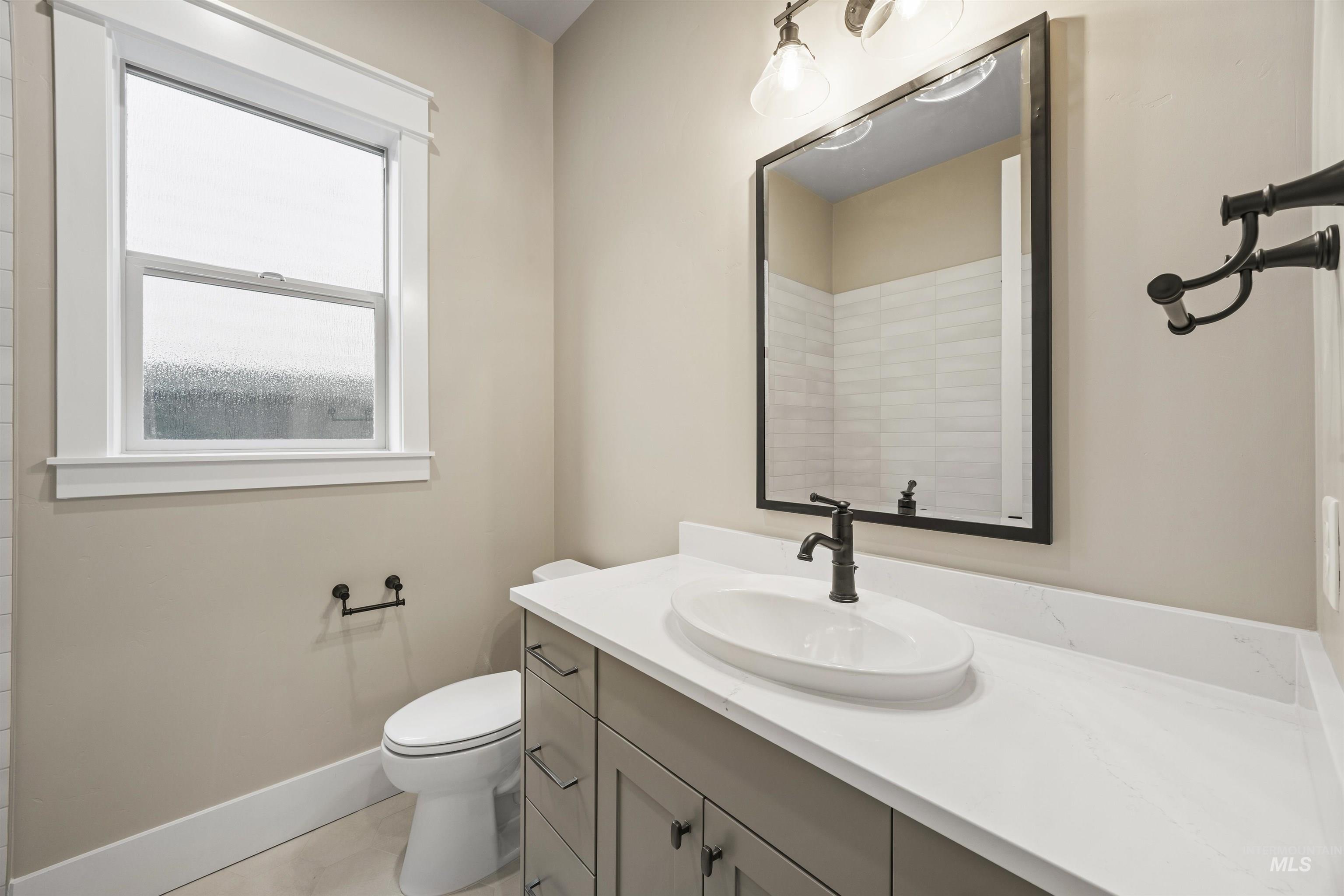 934 East Escalation Street Meridian, ID 83642 - Photo 7 of 50 Bathroom featuring vanity and toilet