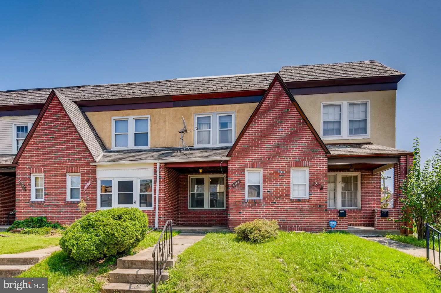 7103 Harford Road Baltimore, MD 21234 - Photo 1 of 27 a front view of a house with garden