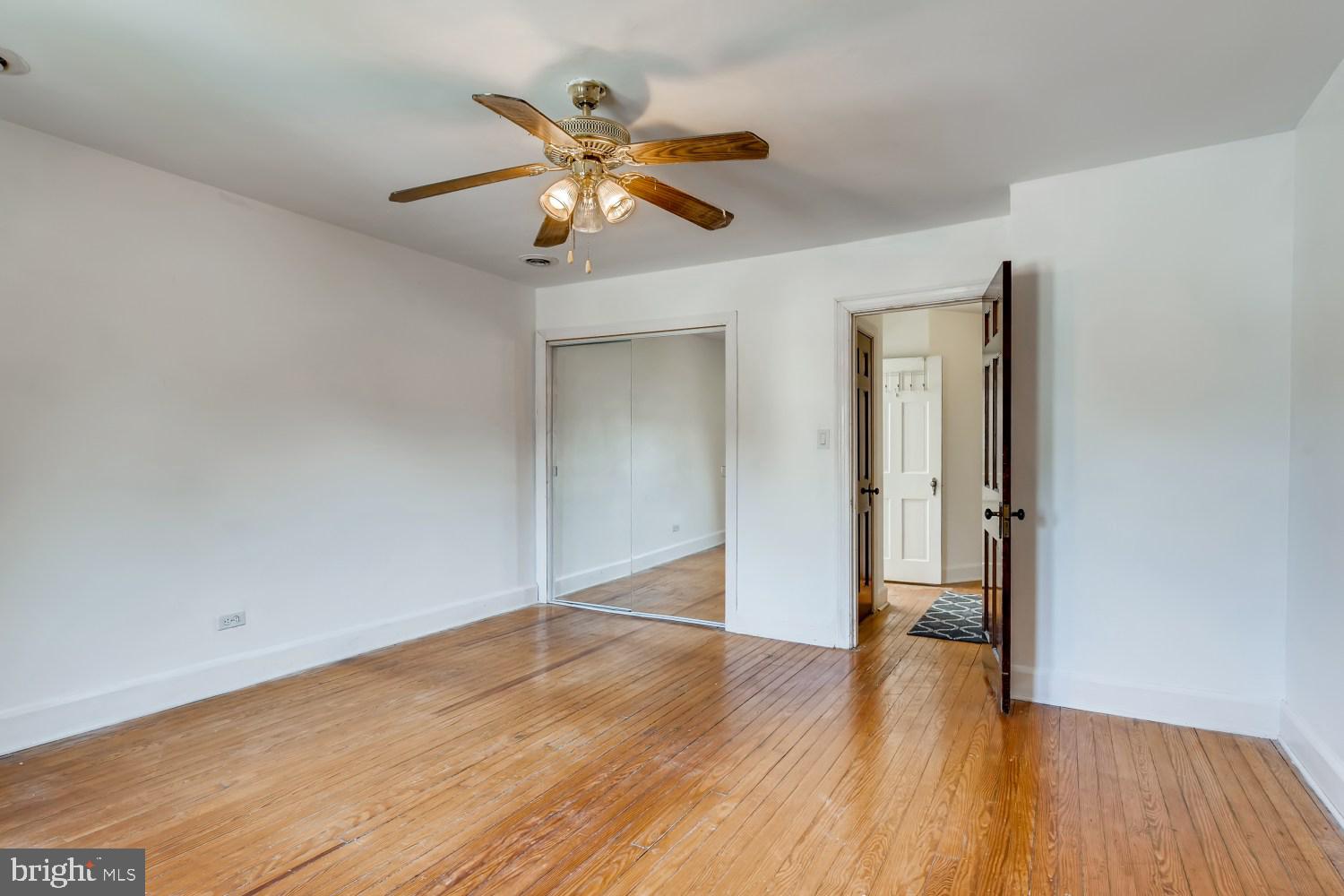 7103 Harford Road Baltimore, MD 21234 - Photo 13 of 27 wooden floor in an empty room