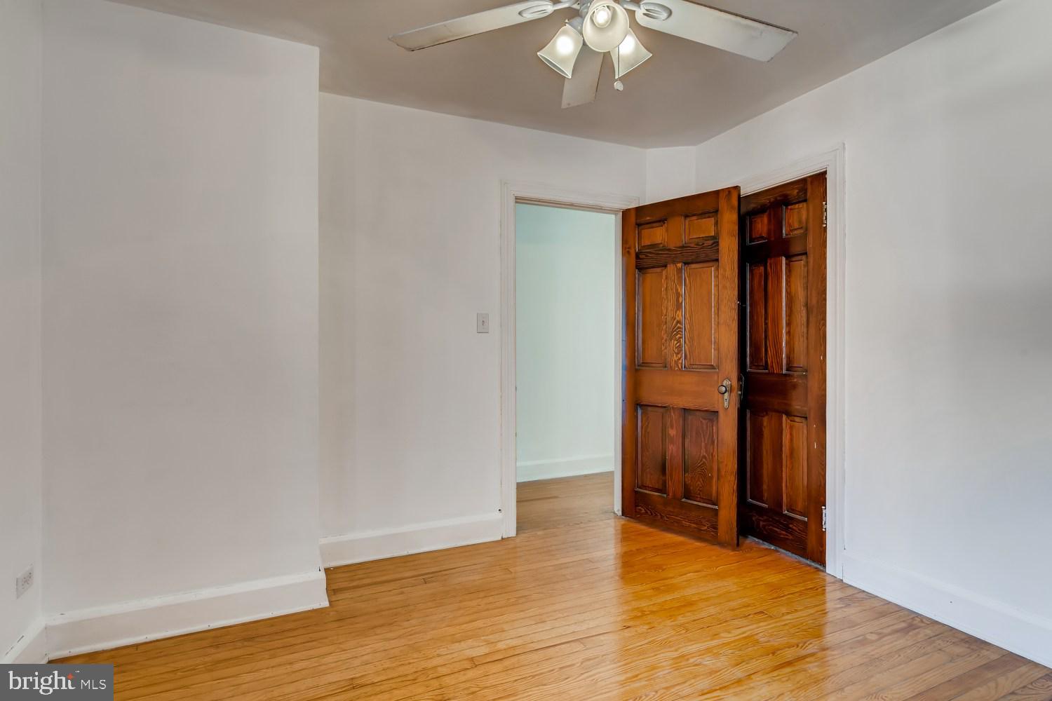 7103 Harford Road Baltimore, MD 21234 - Photo 17 of 27 an empty room with wooden floor and closet