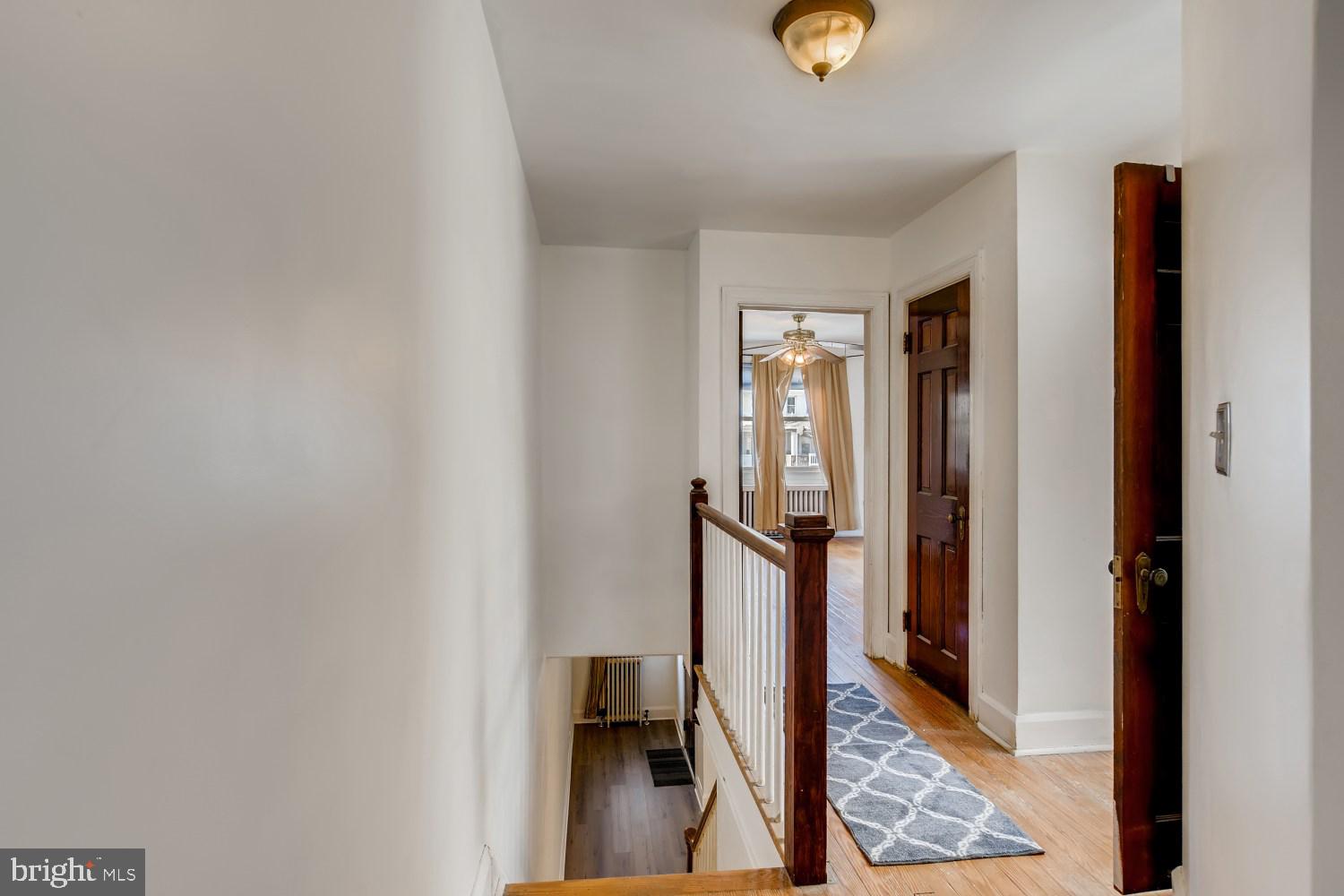 7103 Harford Road Baltimore, MD 21234 - Photo 18 of 27 a view of a livingroom with wooden floor and a rug