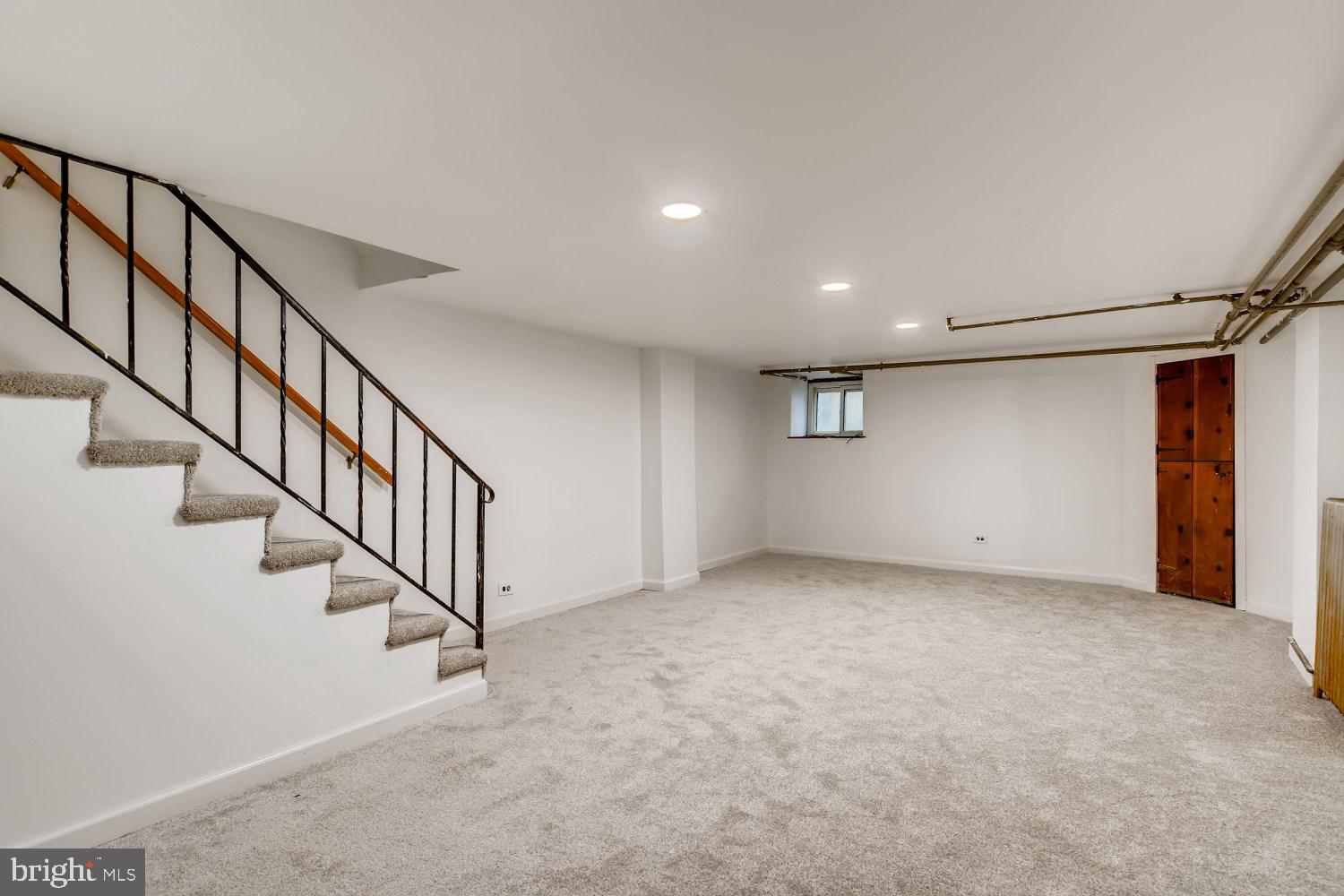 7103 Harford Road Baltimore, MD 21234 - Photo 22 of 27 a view of an empty room with stairs