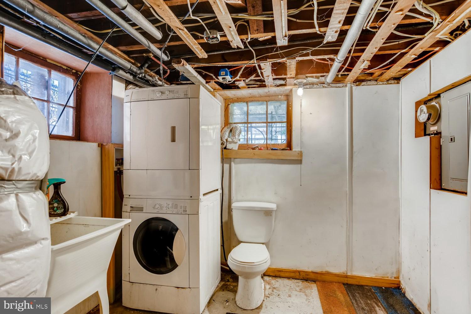 7103 Harford Road Baltimore, MD 21234 - Photo 25 of 27 a utility room with dryer and washer