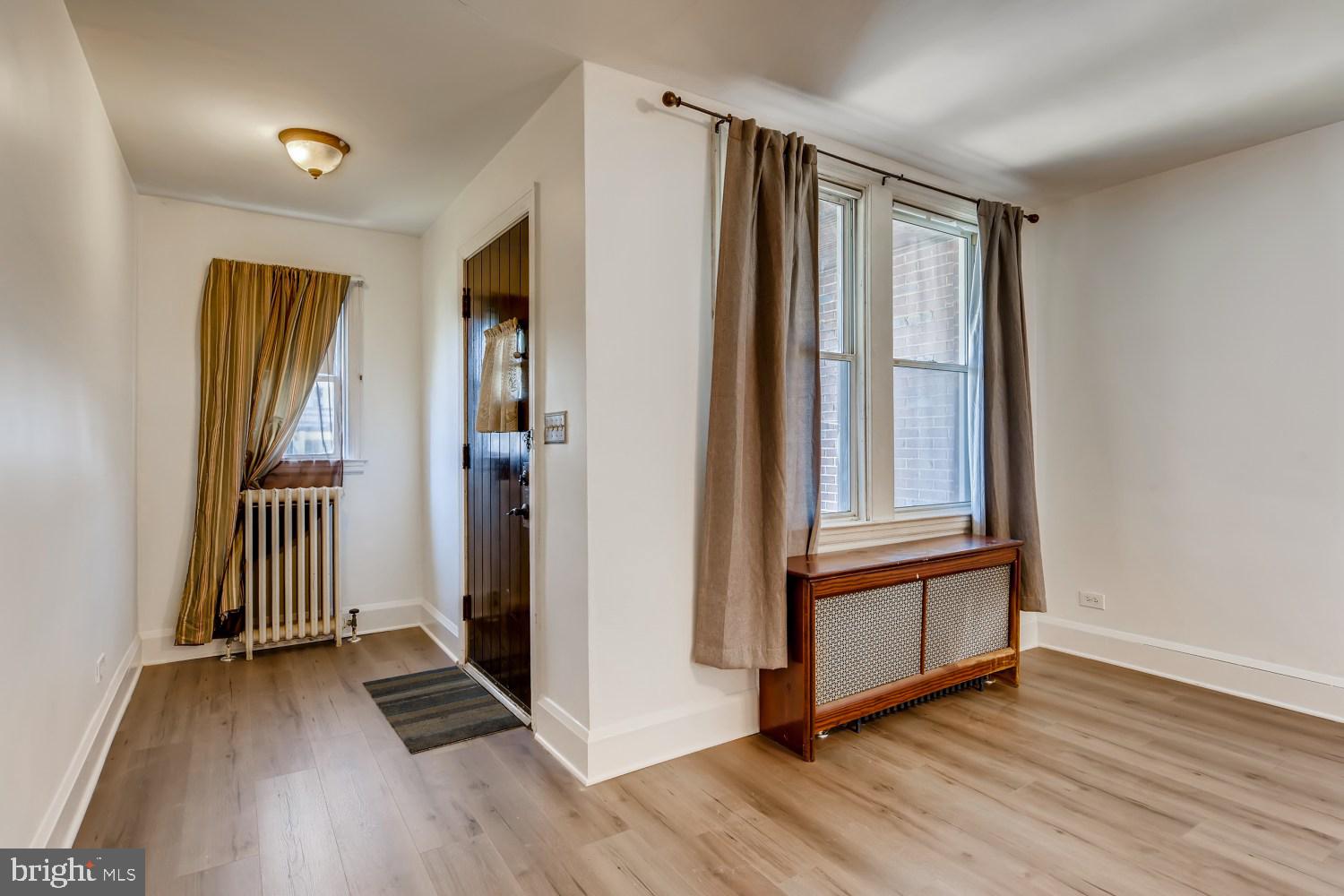 7103 Harford Road Baltimore, MD 21234 - Photo 4 of 27 a view of entryway with wooden floor and stairs