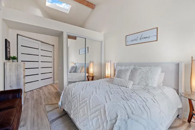 a bed room with a bed and a view