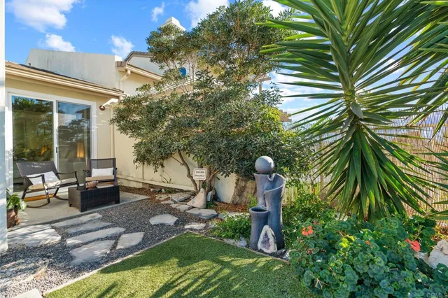 a backyard of a house with seating space