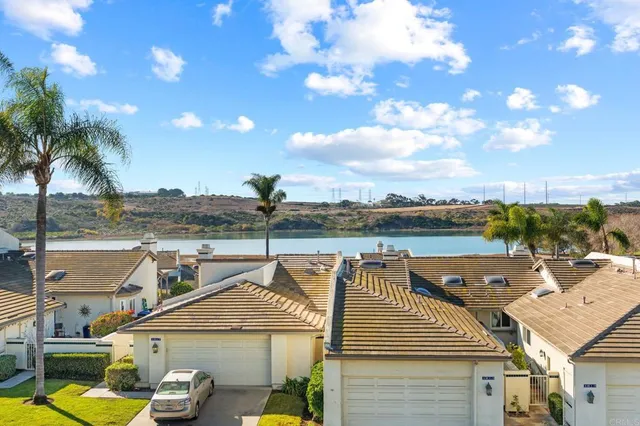a view of a house with pool and ocean view