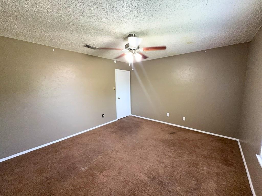 1613 Edgehill Road Benbrook, TX 76126 - Photo 14 of 22 a view of a ceiling fan in a room