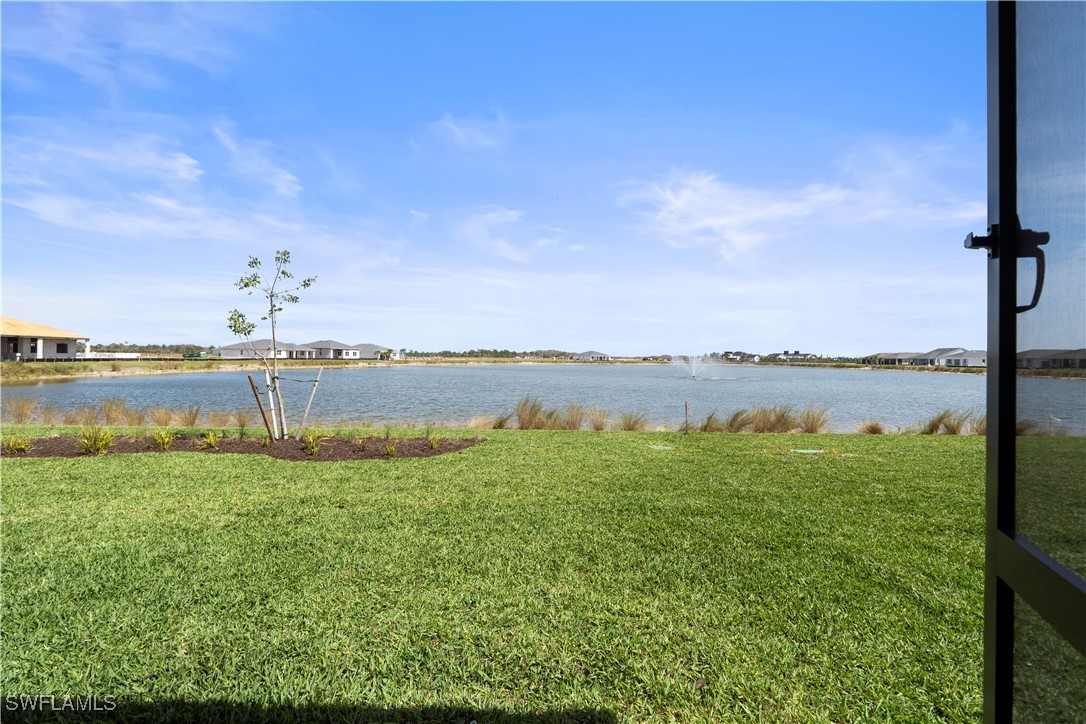 16245 Wax Myrtle Street Punta Gorda, FL 33982 - Photo 4 of 22 a view of a lake with a big yard