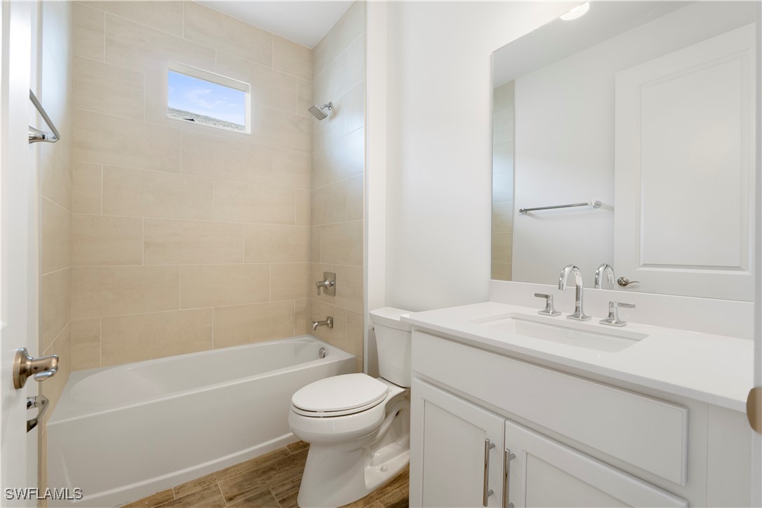 16245 Wax Myrtle Street Punta Gorda, FL 33982 - Photo 10 of 22 a bathroom with a sink a toilet and shower