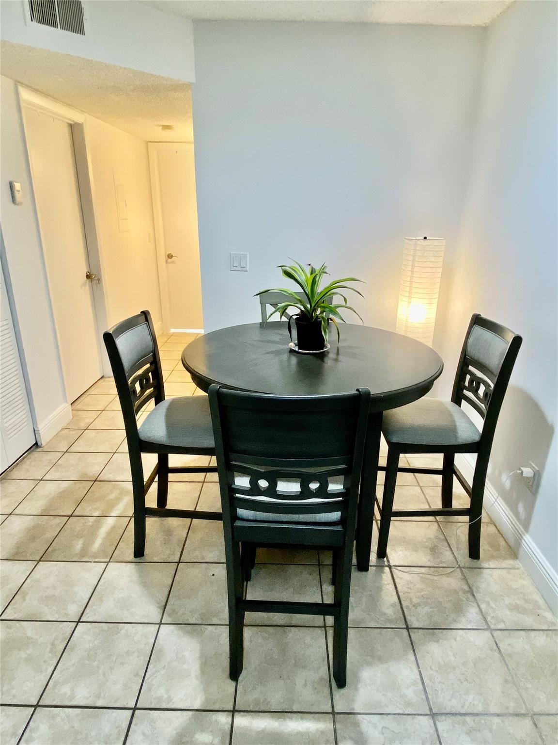 1247 Southwest 46th Avenue, Unit 1301 Pompano Beach, FL 33069 - Photo 12 of 22 a view of a dining room with furniture