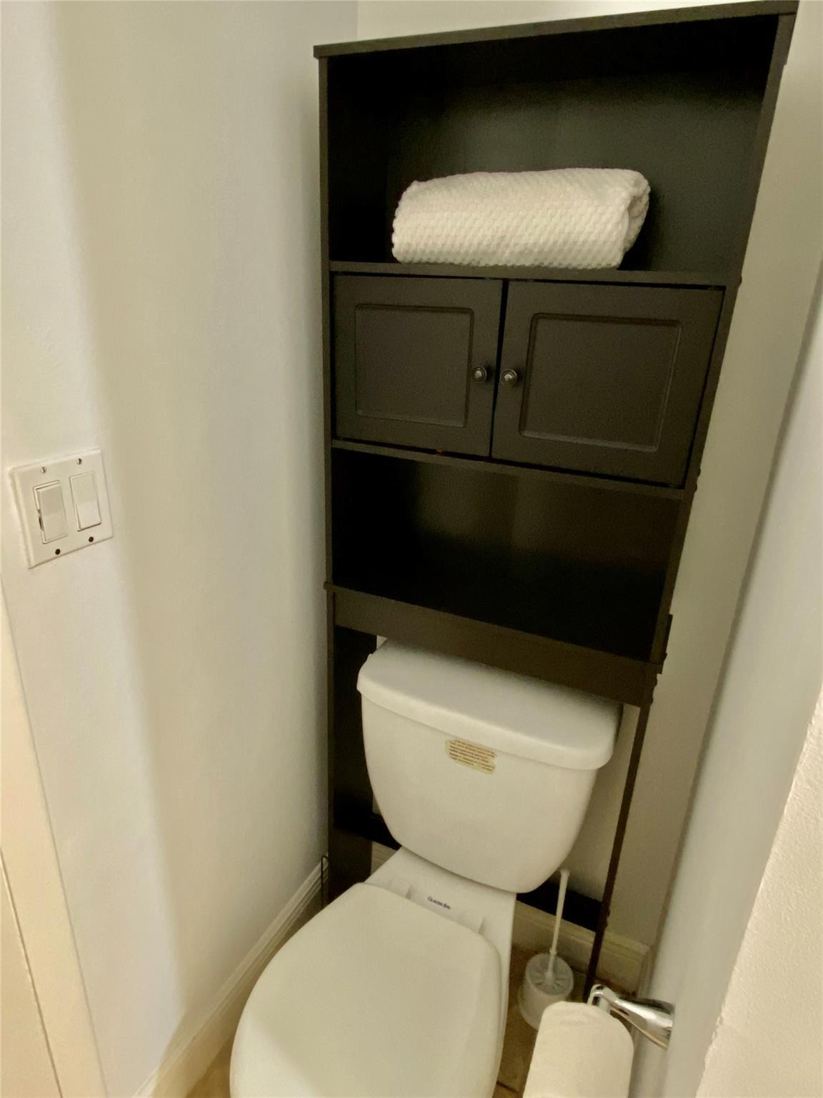 1247 Southwest 46th Avenue, Unit 1301 Pompano Beach, FL 33069 - Photo 18 of 22 a bathroom with a toilet and a sink