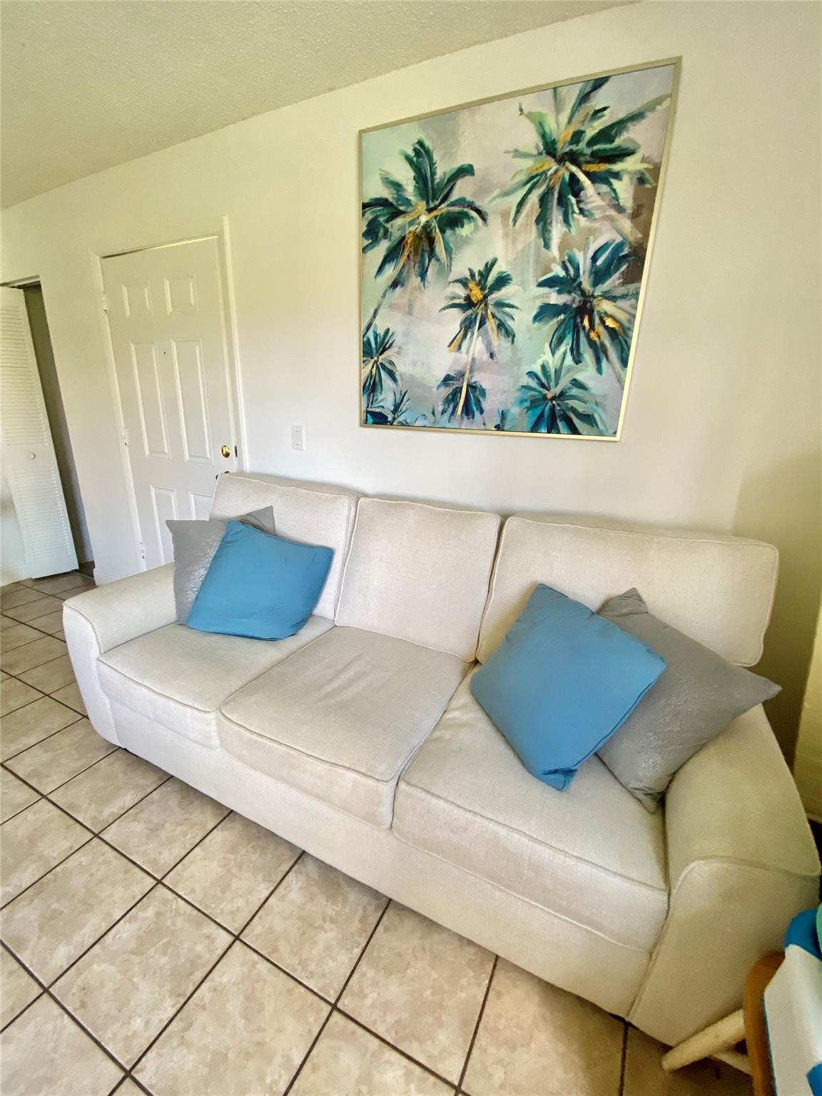 1247 Southwest 46th Avenue, Unit 1301 Pompano Beach, FL 33069 - Photo 5 of 22 a view of a living room with a couch