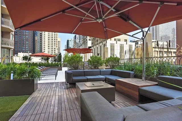 a patio with patio a table and chairs under an umbrella