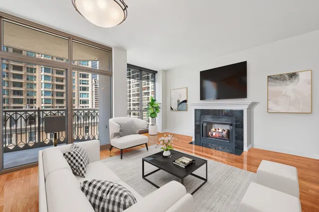 a living room with furniture and a fireplace