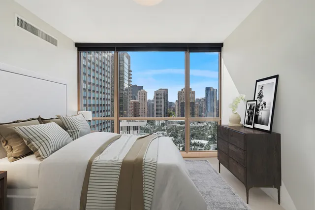 a view of a balcony with furniture and a large window