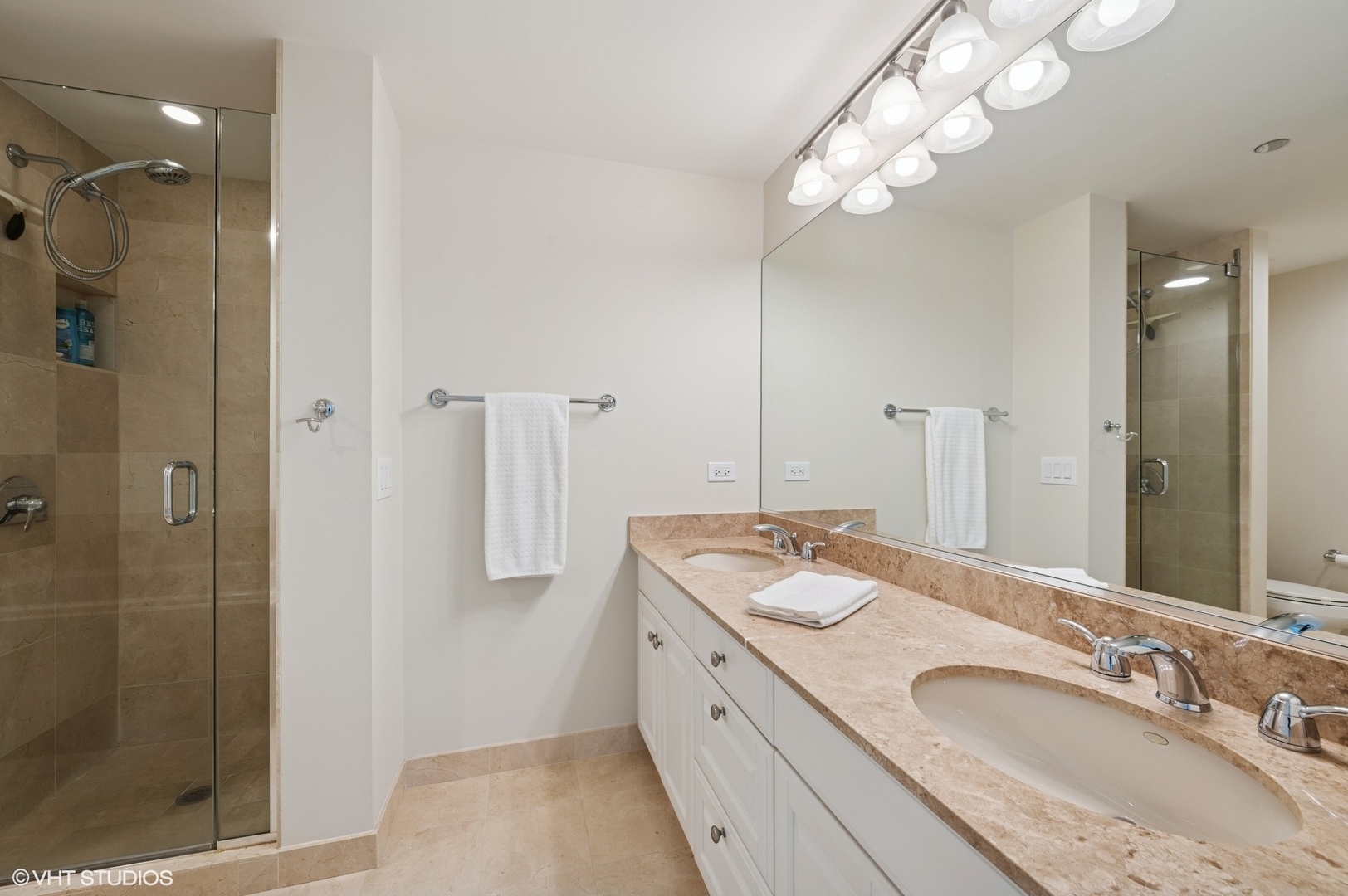 21 East Huron Street, Unit 1407 Chicago, IL 60611 - Photo 8 of 23 a spacious bathroom with a granite countertop sink a mirror and shower