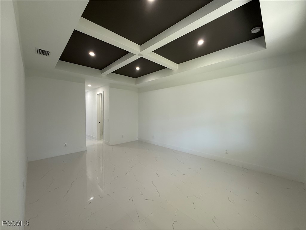 2909 10th Street West Lehigh Acres, FL 33971 - Photo 12 of 31 an empty room with wooden floor and windows