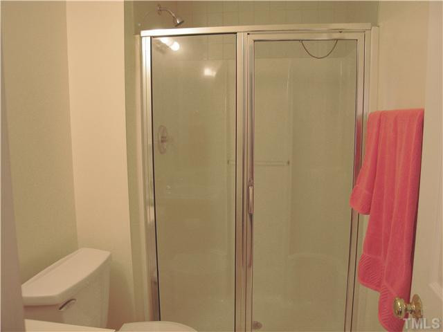 4906 Gable Ridge Drive Durham, NC 27713 - Photo 12 of 24 Master Bath Has a Large Walk In Shower. No tub side to step over. Not seen is the NEW sink and faucet. Bathroom