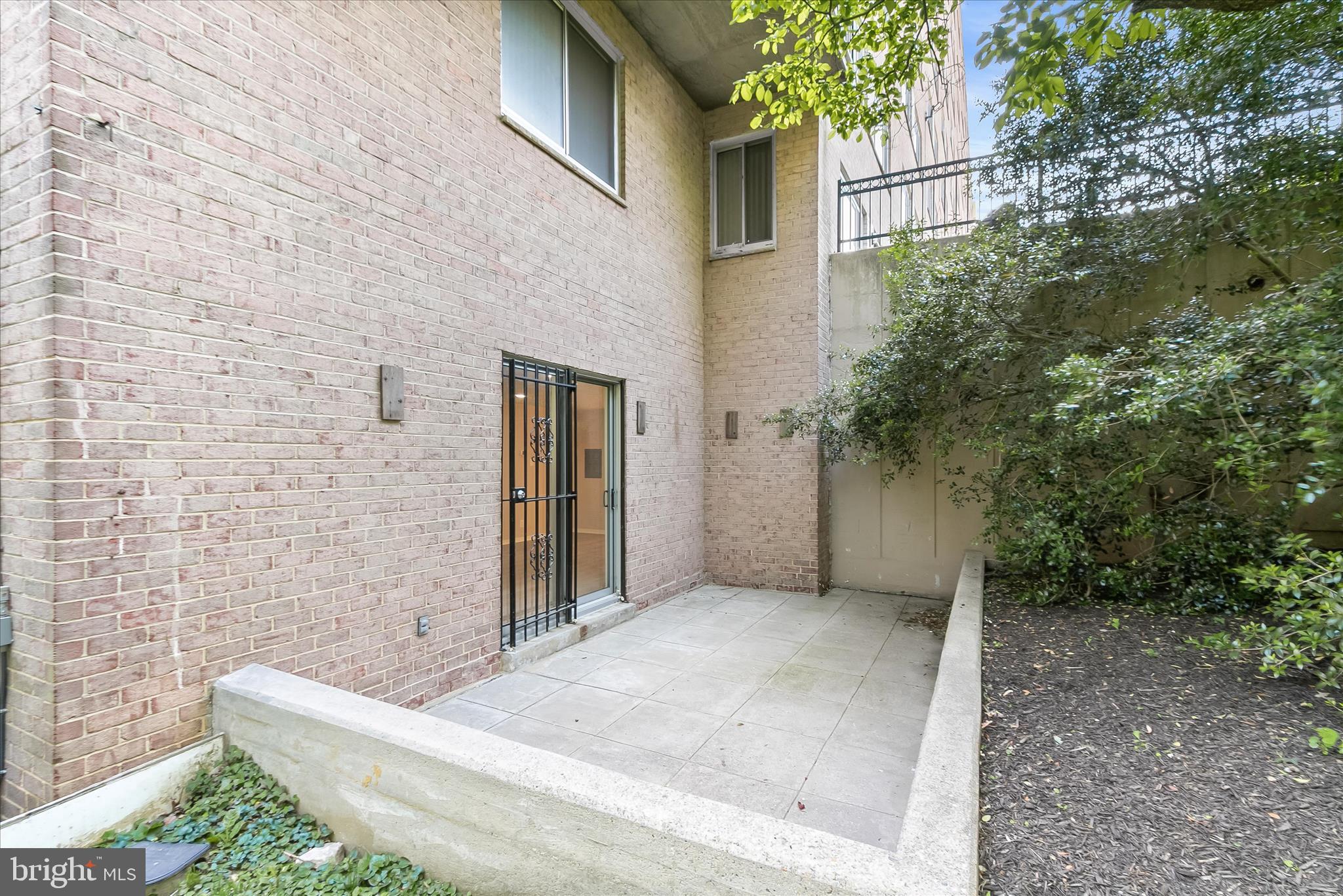 1900 Lyttonsville Road, Unit 216 Silver Spring, MD 20910 - Photo 11 of 36 a view of a patio of the house