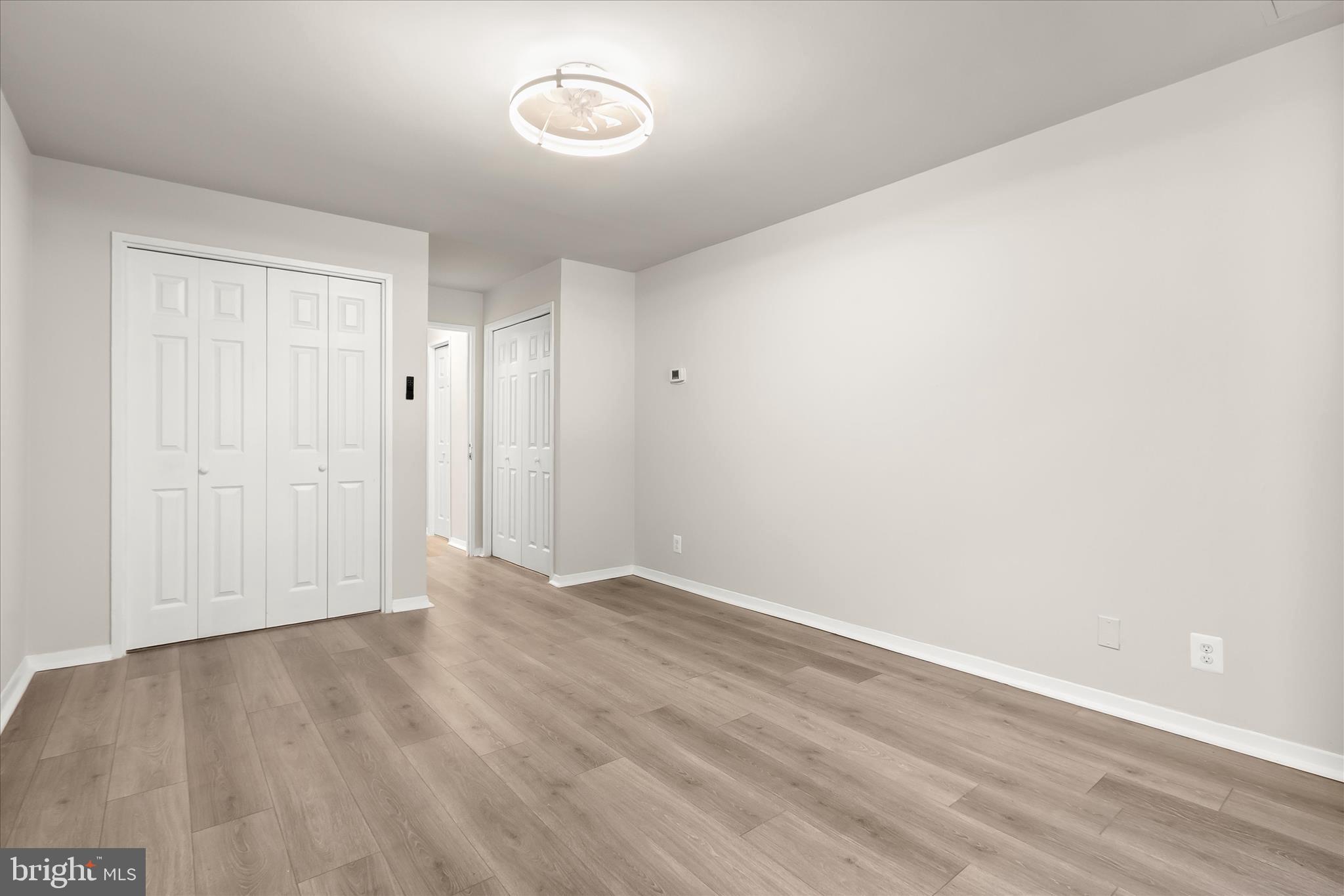 1900 Lyttonsville Road, Unit 216 Silver Spring, MD 20910 - Photo 17 of 36 a view of an empty room with wooden floor