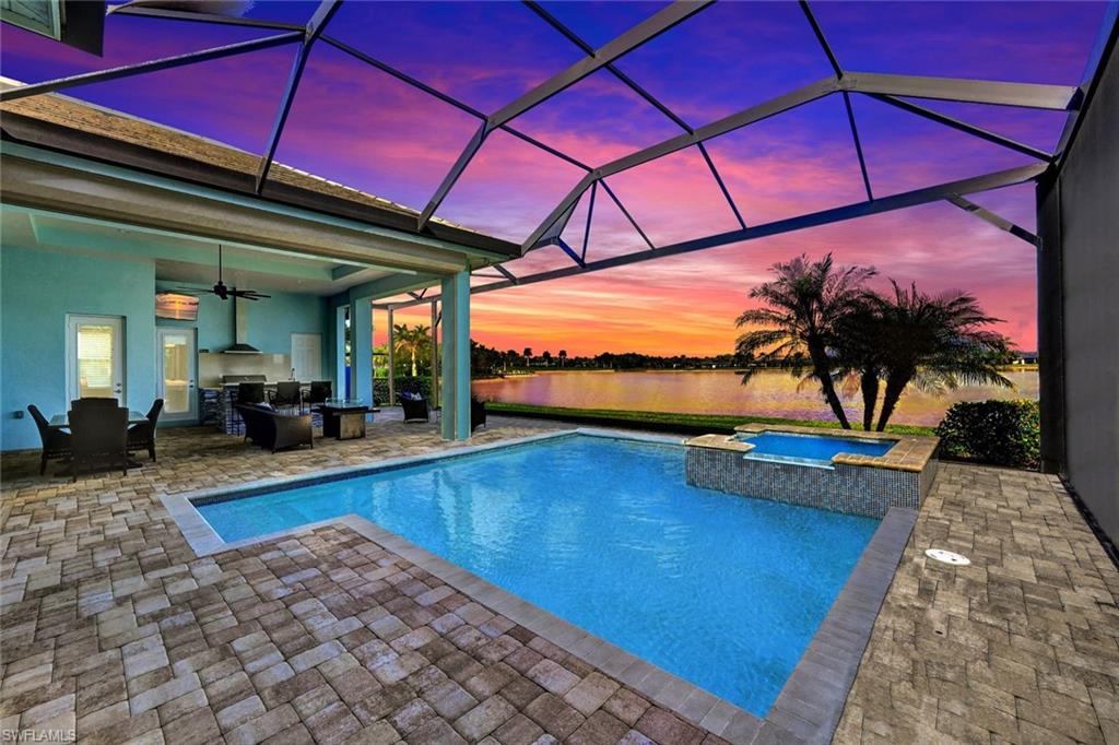 a view of swimming pool with outdoor seating