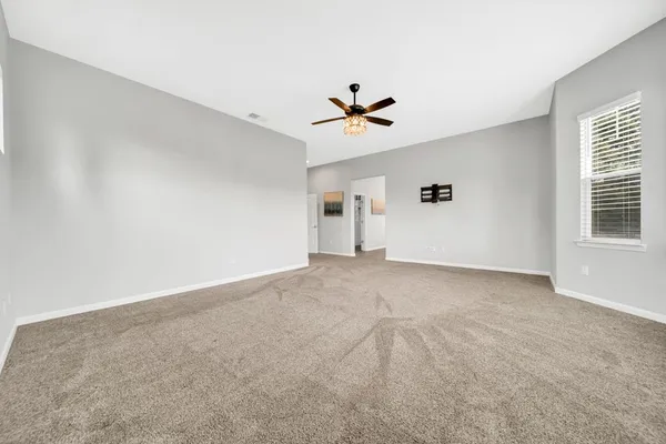 a spacious bathroom with a tub shower and sink