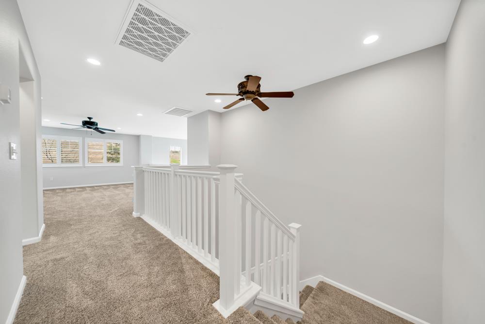20300 Panoz Road Patterson, CA 95363 - Photo 26 of 61 a view of a hallway with windows