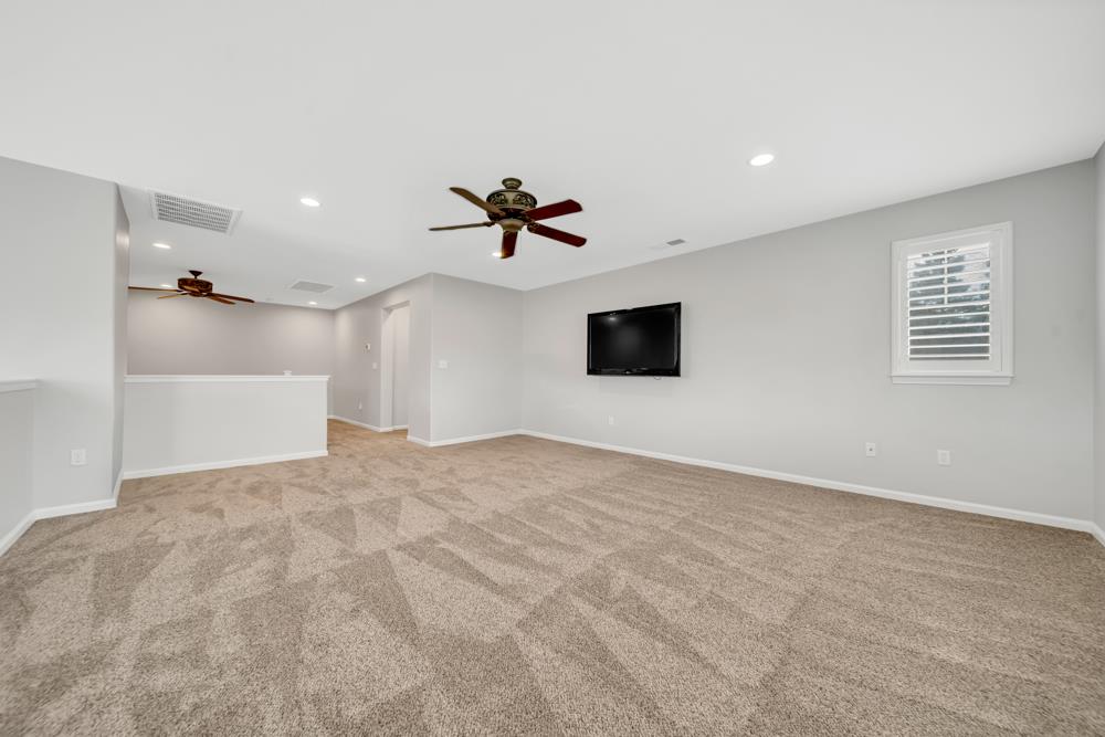 20300 Panoz Road Patterson, CA 95363 - Photo 28 of 61 a view of empty room with a ceiling fan