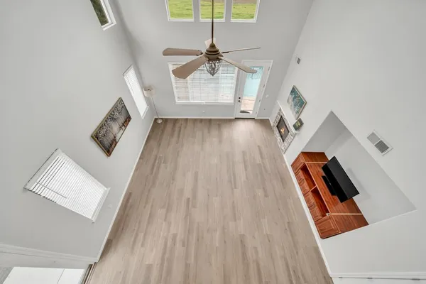 a view of a livingroom with wooden floor
