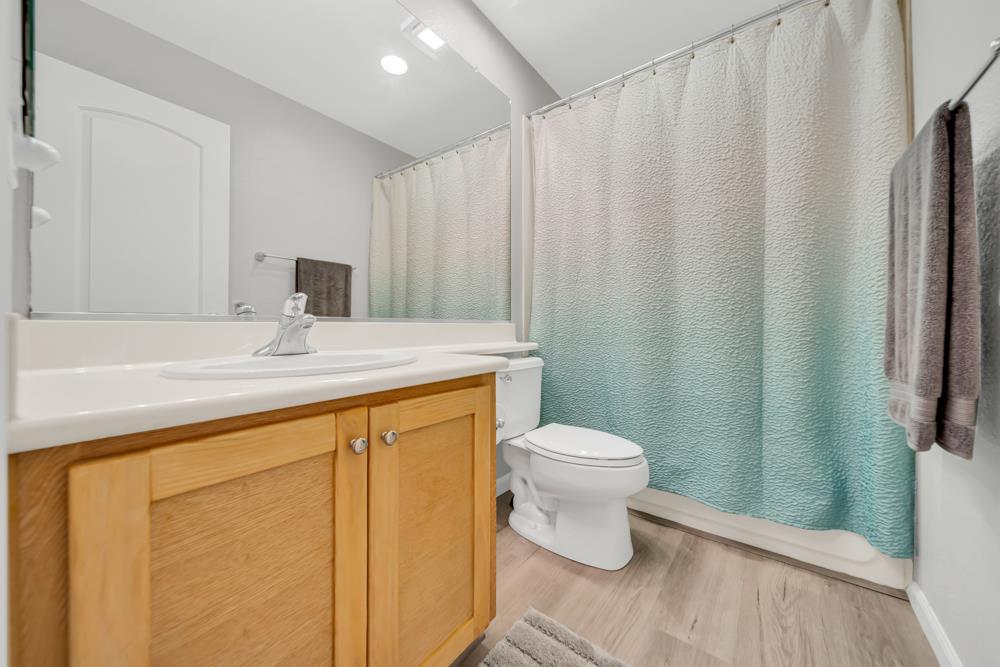 20300 Panoz Road Patterson, CA 95363 - Photo 31 of 61 a bathroom with a sink a toilet and shower