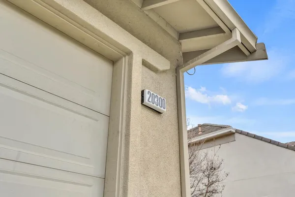 a view of a house with a potted plant