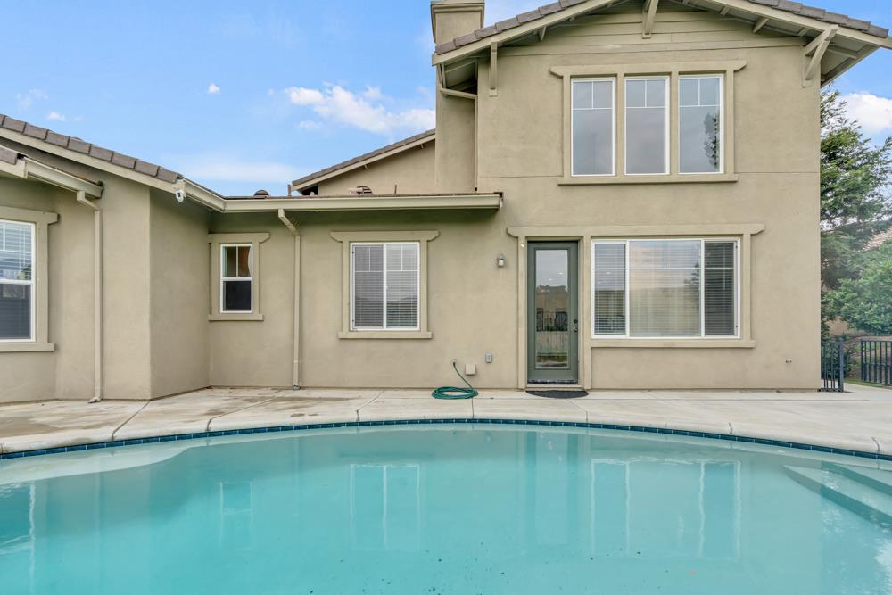 20300 Panoz Road Patterson, CA 95363 - Photo 48 of 61 a front view of a house with a yard