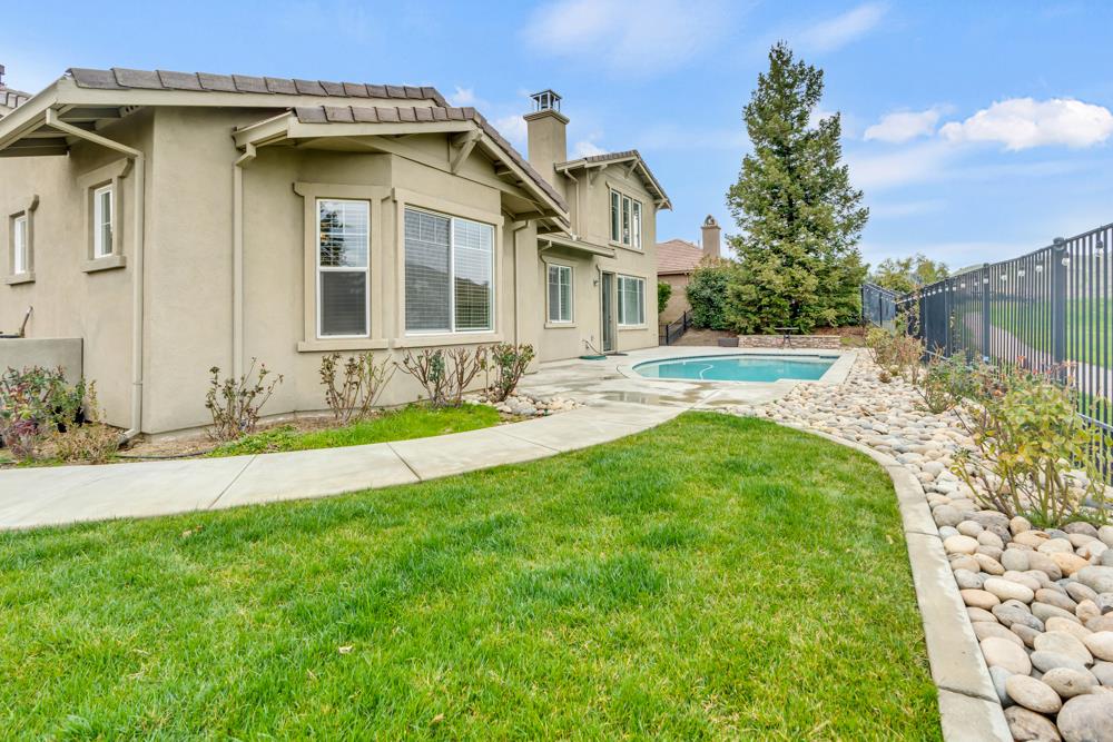 20300 Panoz Road Patterson, CA 95363 - Photo 49 of 61 a front view of a house with garden