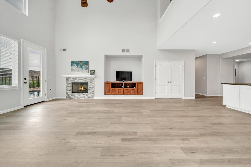 20300 Panoz Road Patterson, CA 95363 - Photo 9 of 61 an empty room with furniture and a fireplace