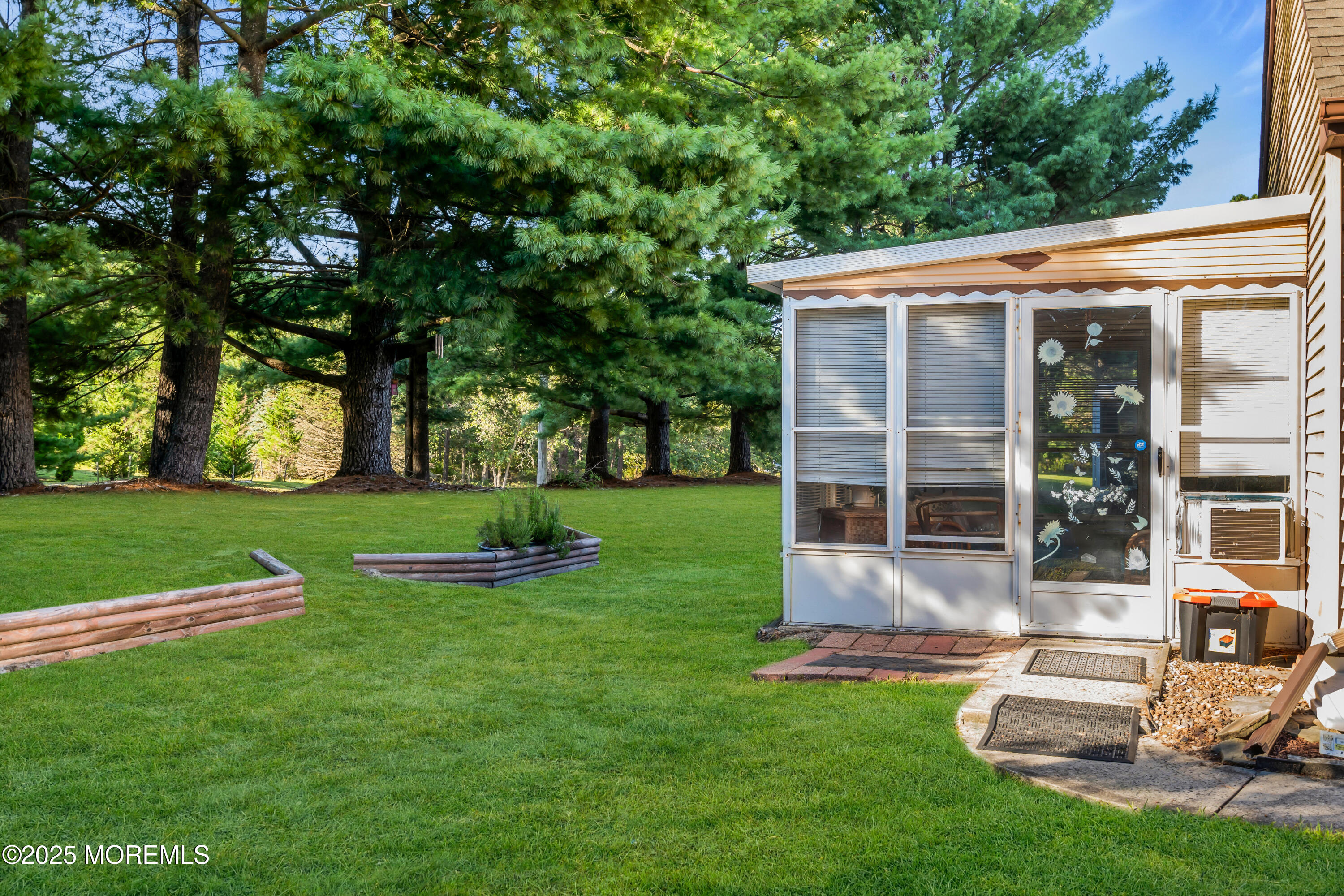 30 A Mill Road, Unit 64 Whiting, NJ 08759 - Photo 11 of 46 a view of a house with a yard porch and sitting area