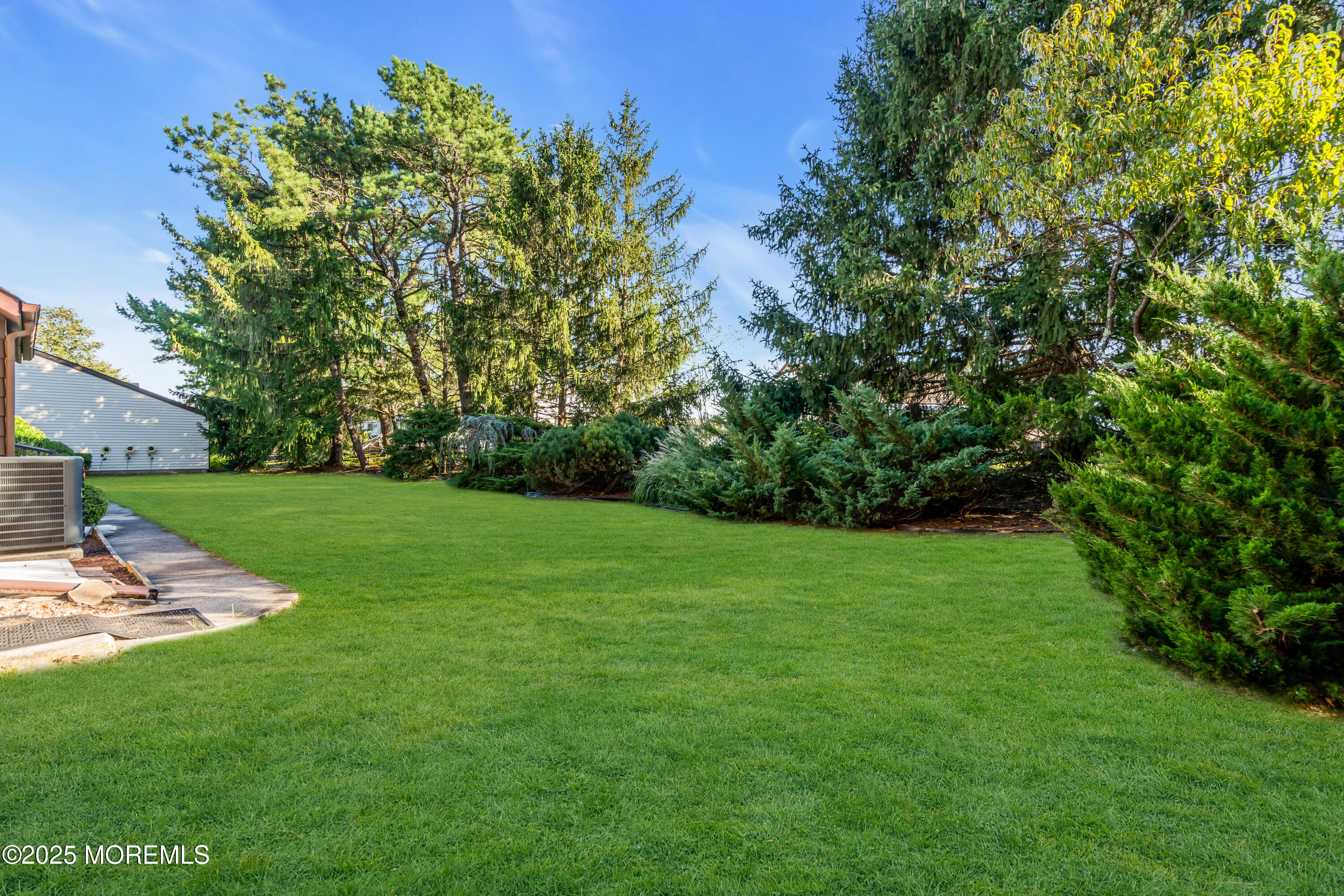 30 A Mill Road, Unit 64 Whiting, NJ 08759 - Photo 13 of 46 a view of a grassy field with trees