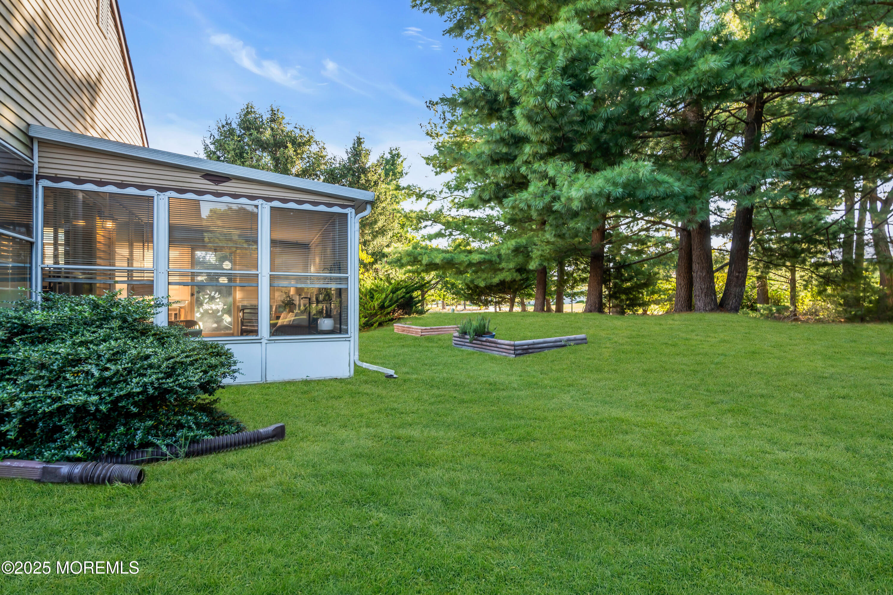 30 A Mill Road, Unit 64 Whiting, NJ 08759 - Photo 14 of 46 a front view of a house with garden