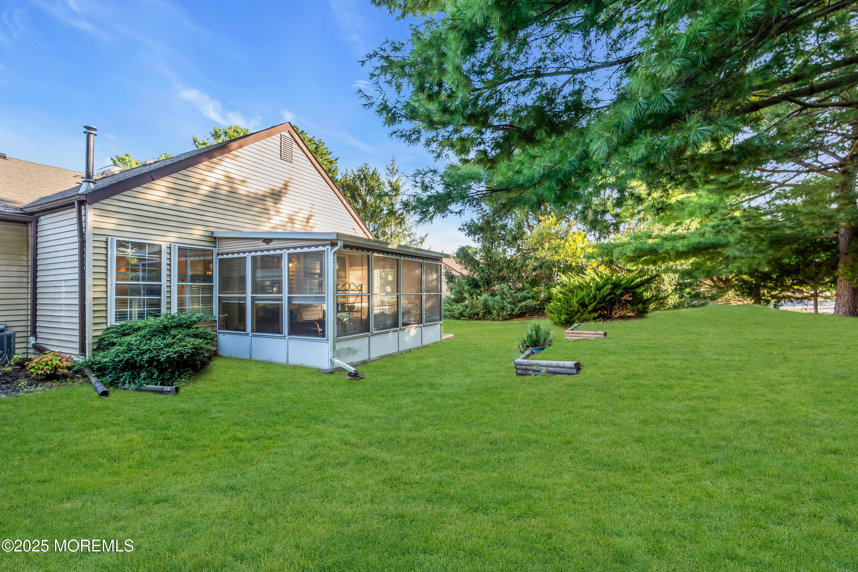 30 A Mill Road, Unit 64 Whiting, NJ 08759 - Photo 15 of 46 a view of a house with a yard and sitting area