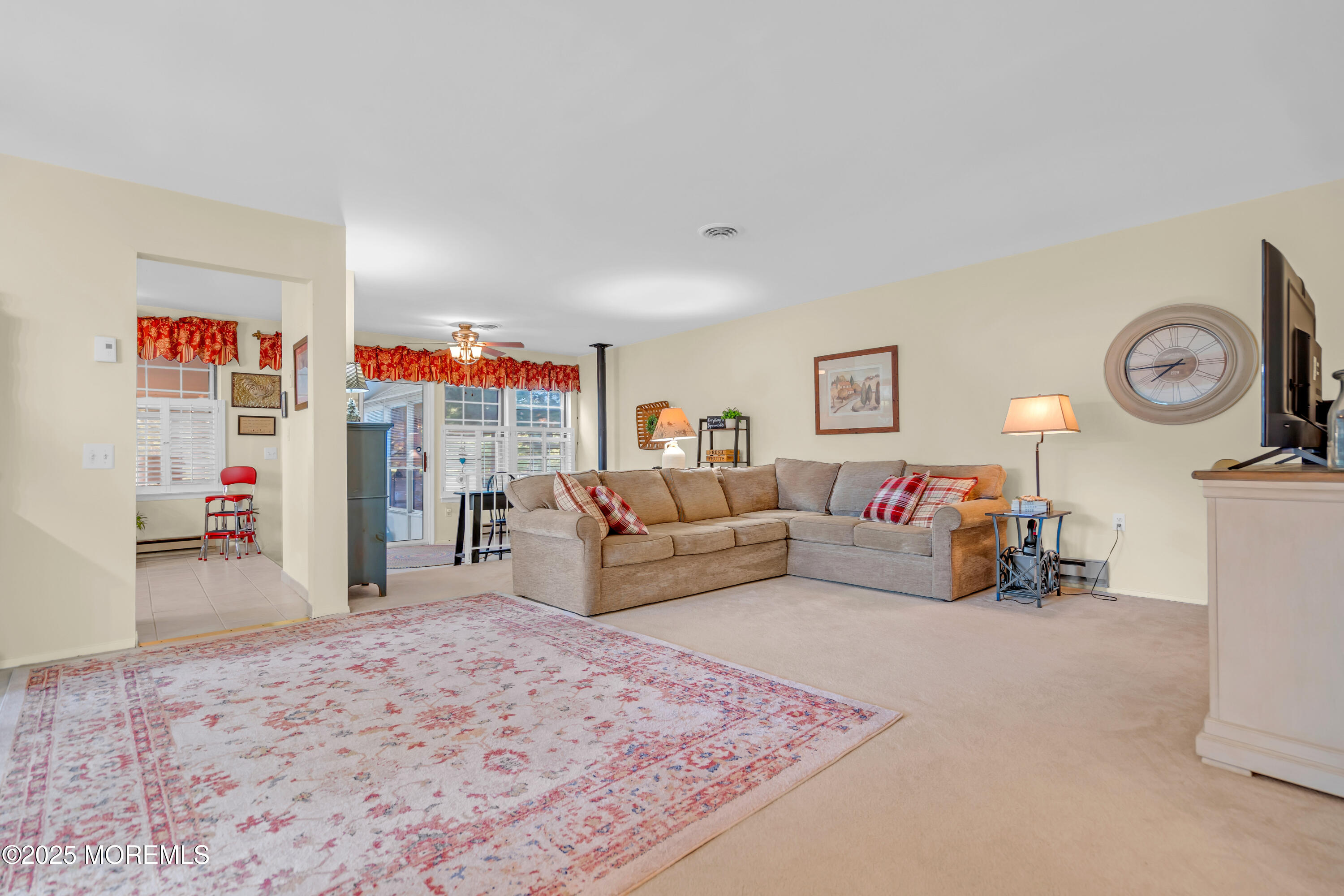 30 A Mill Road, Unit 64 Whiting, NJ 08759 - Photo 19 of 46 a living room with furniture and a flat screen tv