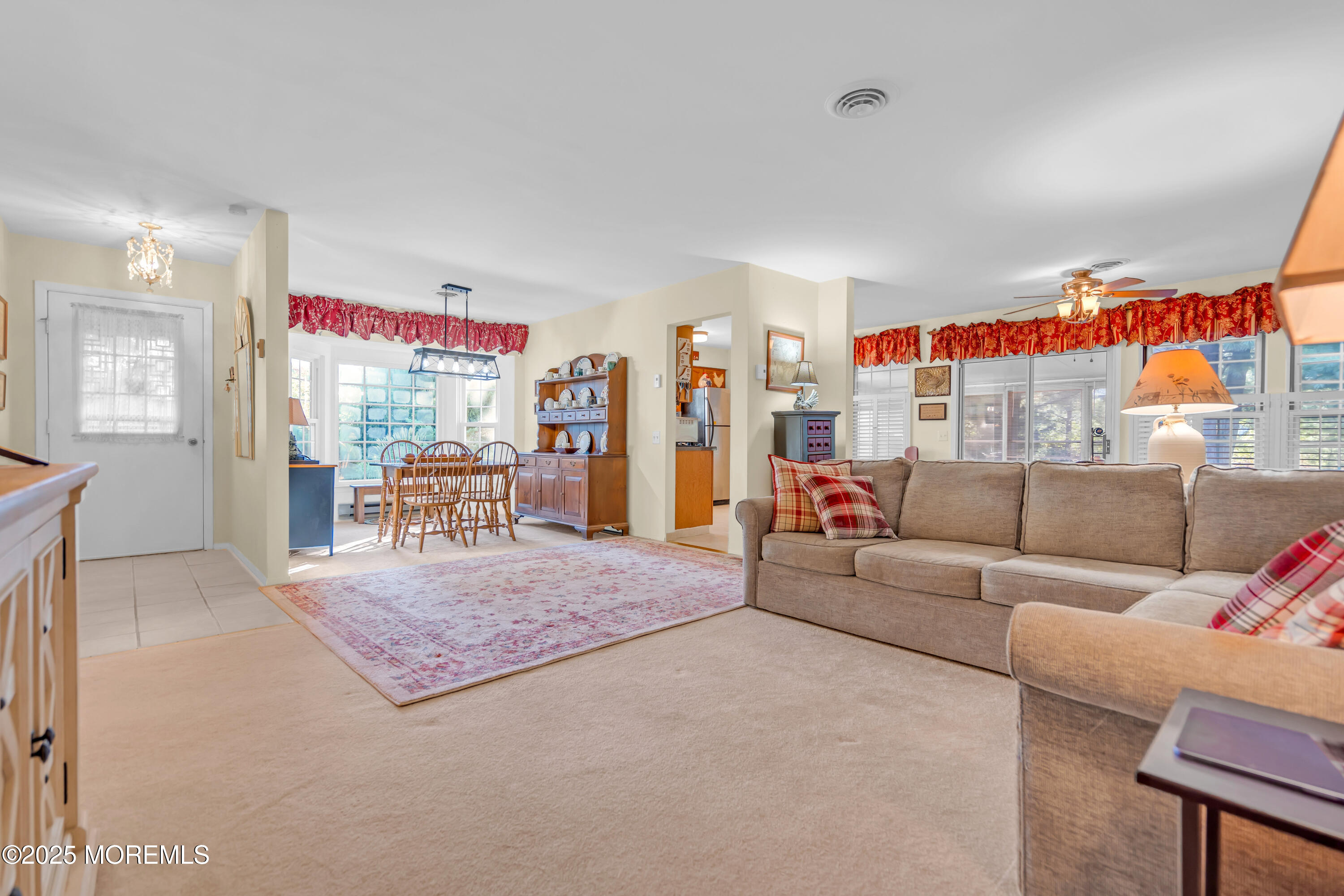 30 A Mill Road, Unit 64 Whiting, NJ 08759 - Photo 20 of 46 a living room with furniture and a flat screen tv