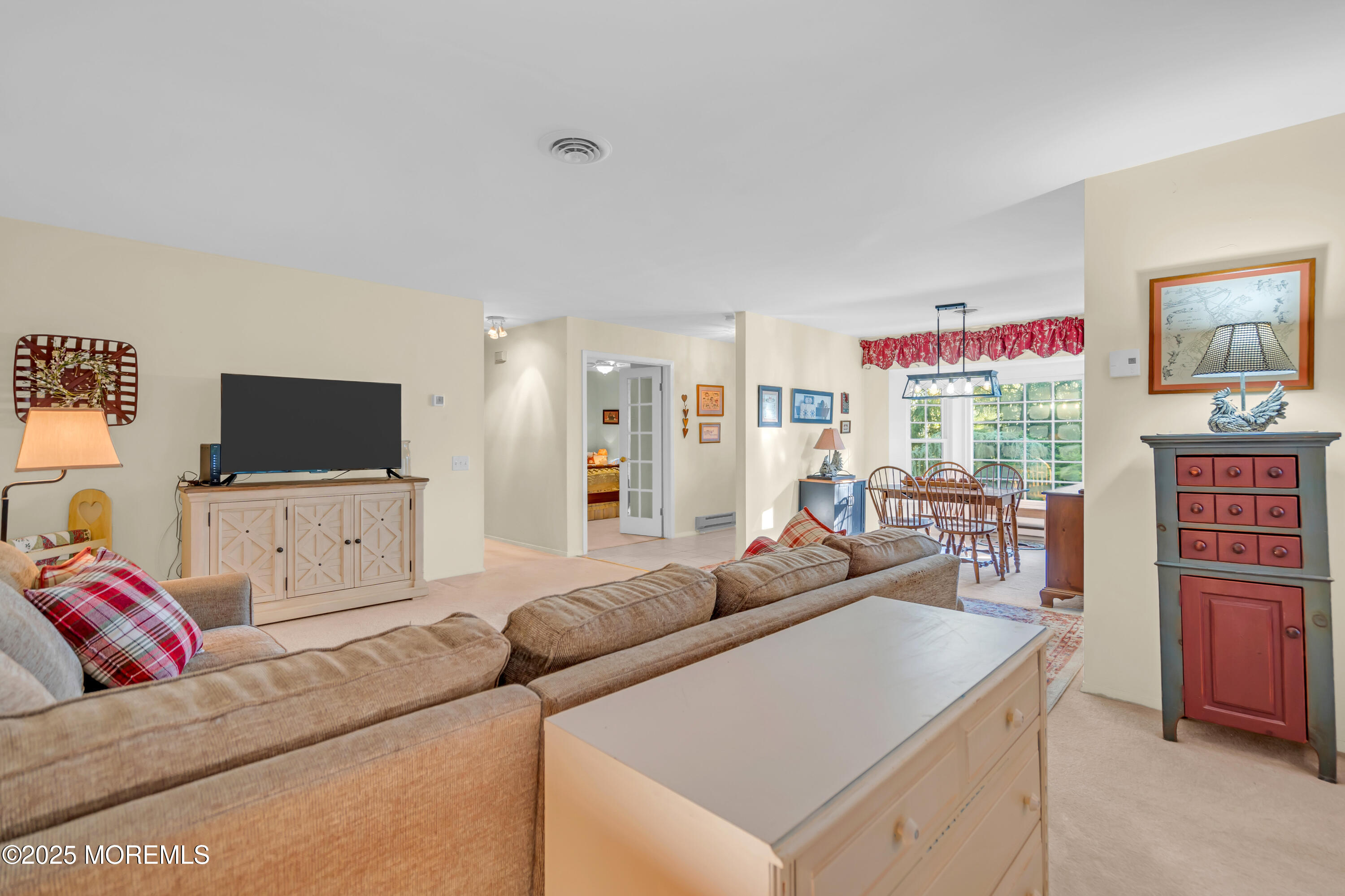 30 A Mill Road, Unit 64 Whiting, NJ 08759 - Photo 22 of 46 a living room with furniture and a flat screen tv