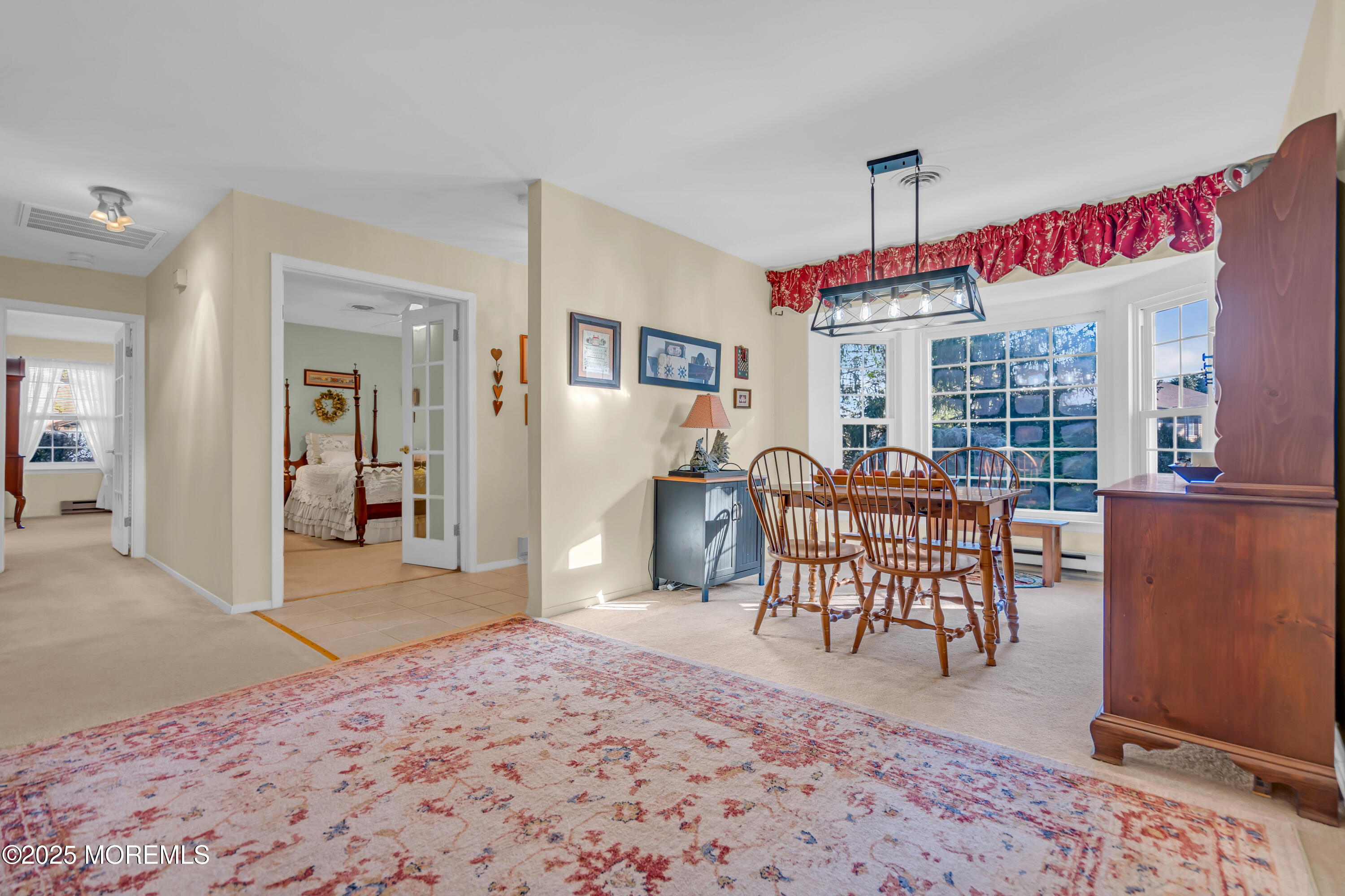 30 A Mill Road, Unit 64 Whiting, NJ 08759 - Photo 23 of 46 a view of a dining room with furniture window and wooden floor