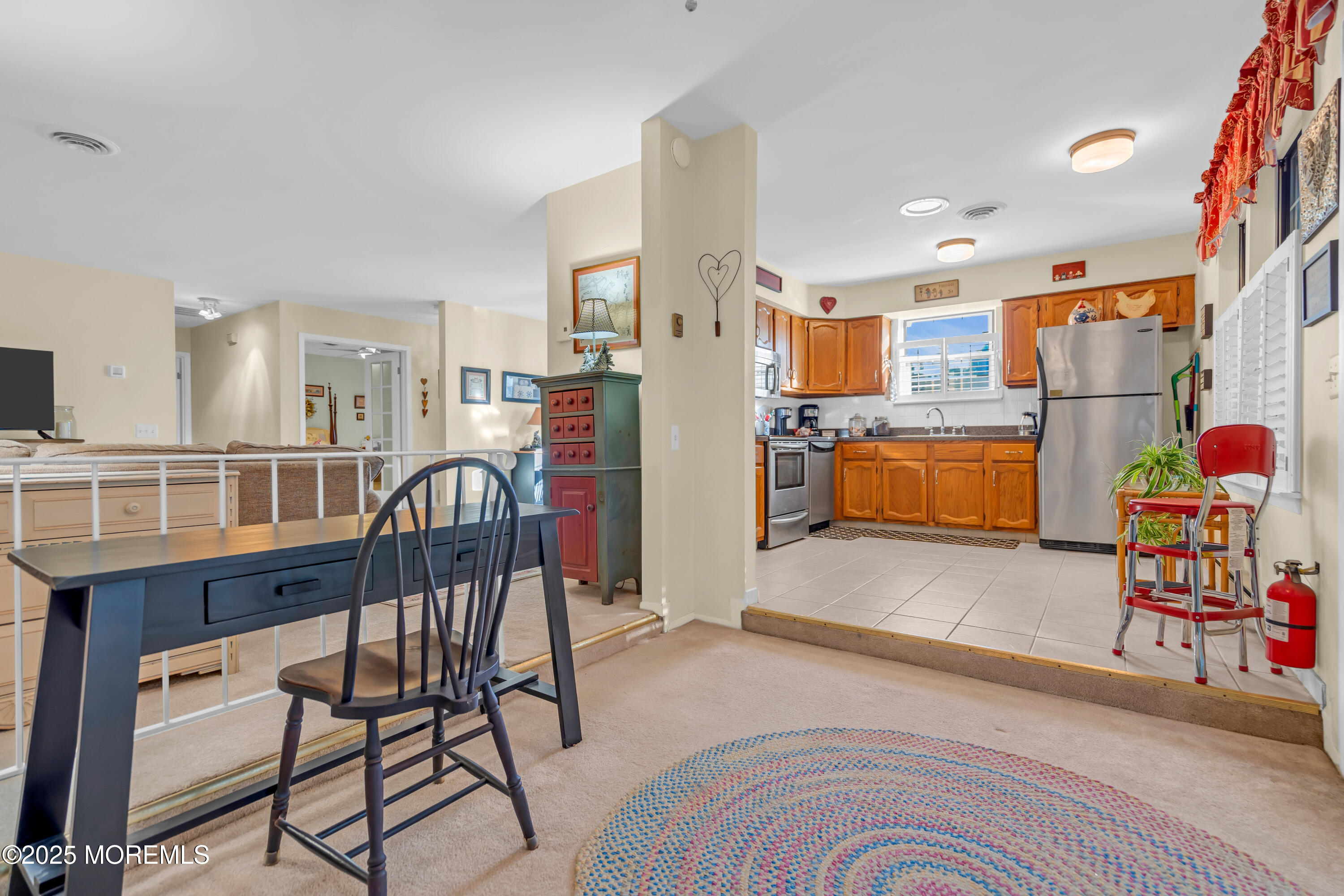 30 A Mill Road, Unit 64 Whiting, NJ 08759 - Photo 27 of 46 a bedroom with furniture and a kitchen