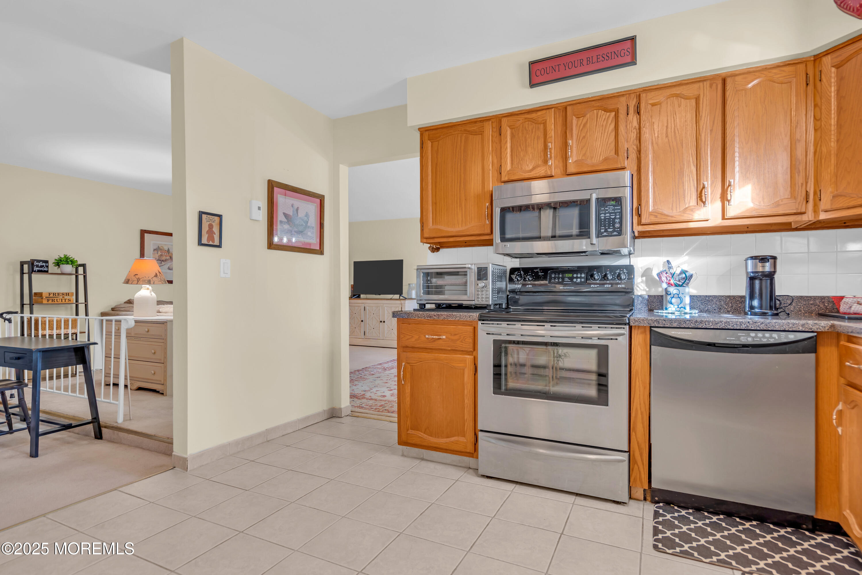 30 A Mill Road, Unit 64 Whiting, NJ 08759 - Photo 28 of 46 a kitchen with stainless steel appliances granite countertop a refrigerator and a stove top oven