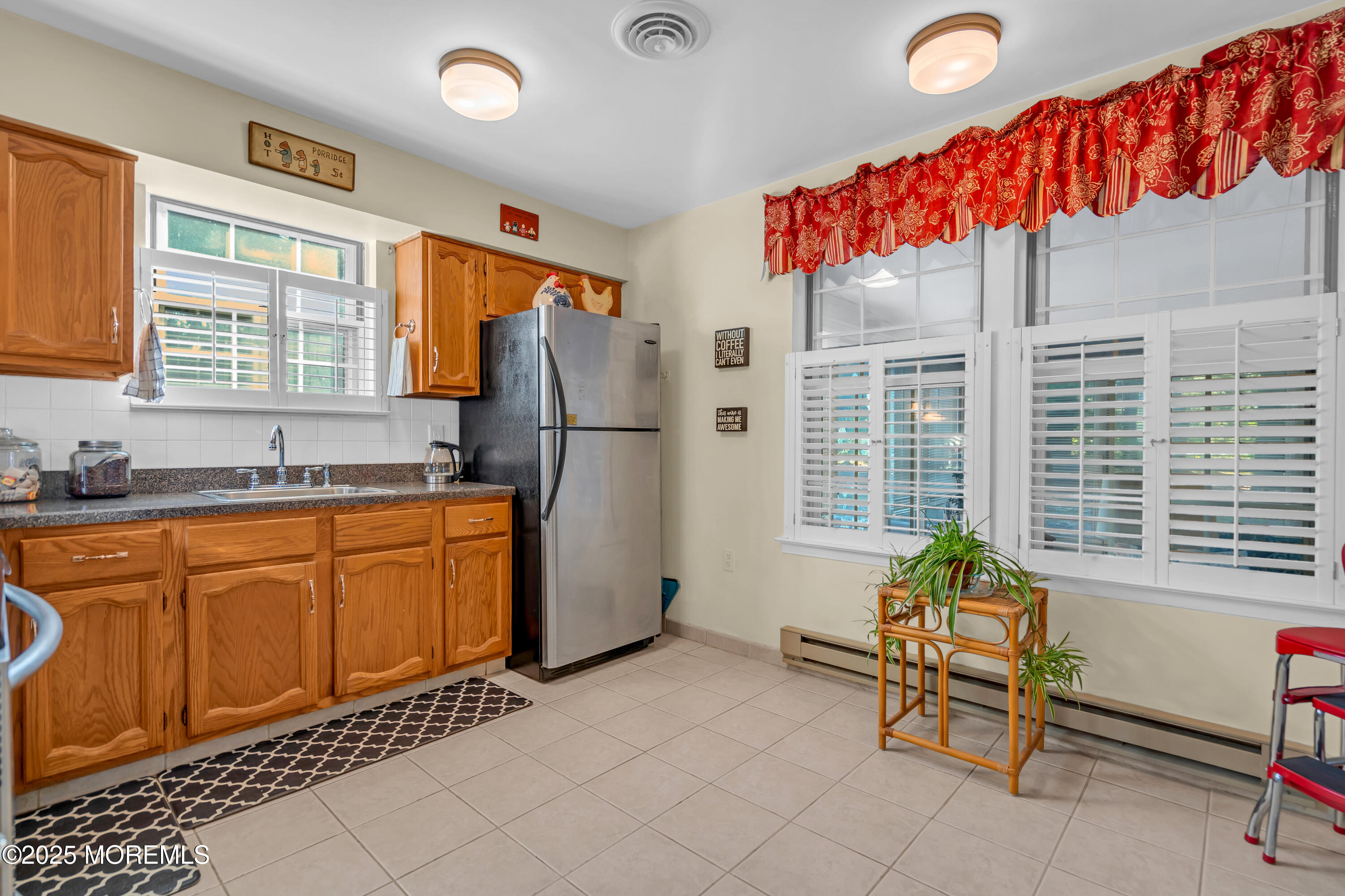30 A Mill Road, Unit 64 Whiting, NJ 08759 - Photo 30 of 46 a living room with furniture a dining table and a refrigerator