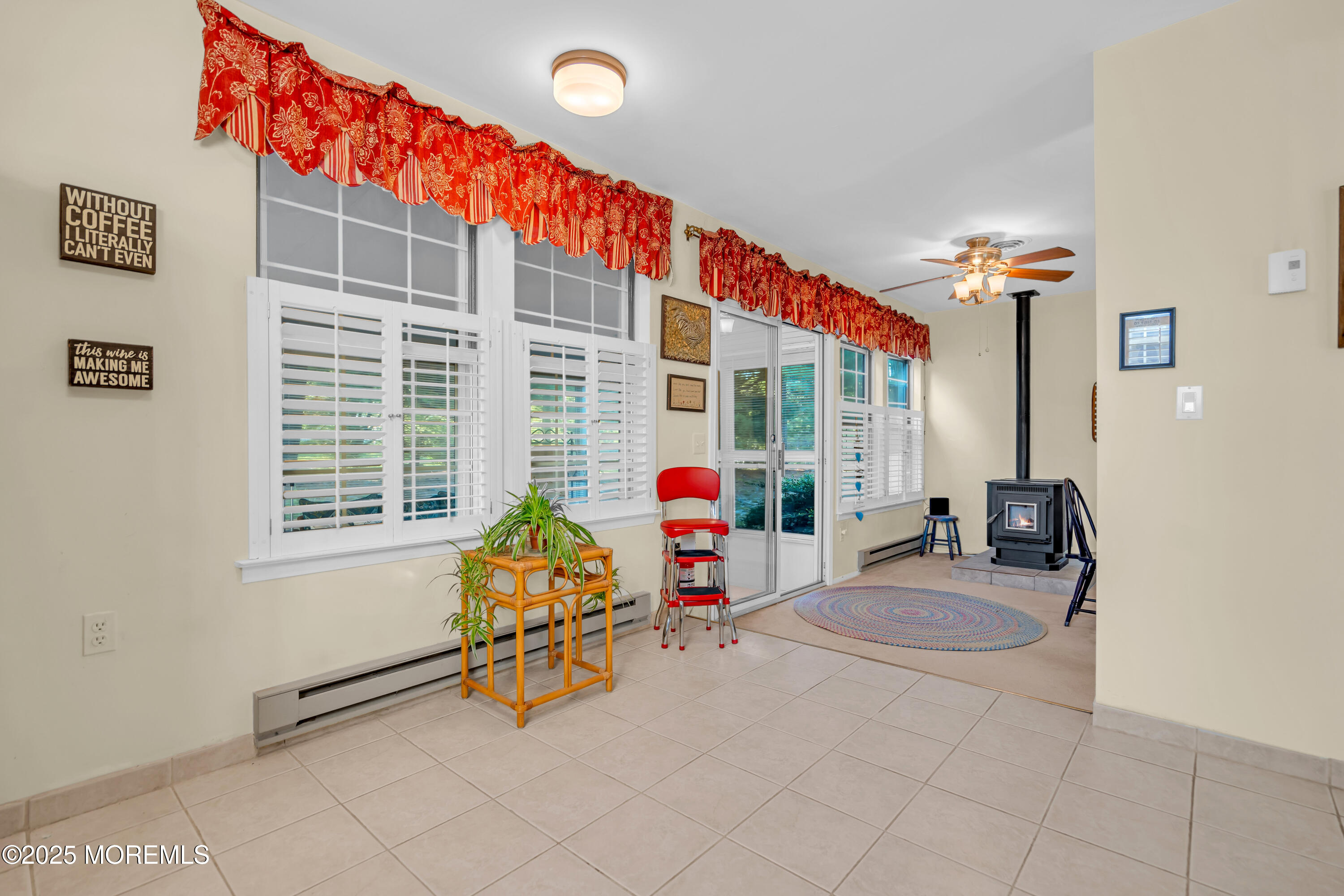 30 A Mill Road, Unit 64 Whiting, NJ 08759 - Photo 31 of 46 a living room with furniture and floor to ceiling window